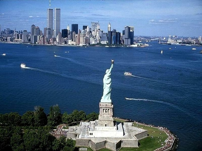 New York Skyline with Statue of Liberty at day.jpg